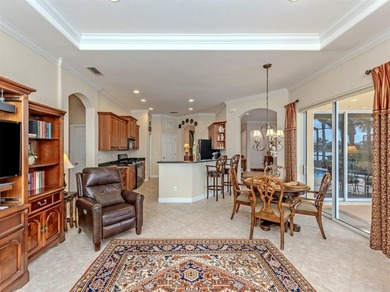 Welcome home to easy Florida living with peaceful lake views on Venetian Golf and River Club in Florida - for sale on GolfHomes.com, golf home, golf lot