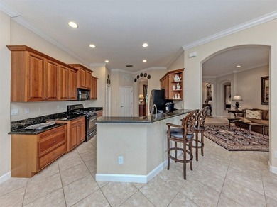 Welcome home to easy Florida living with peaceful lake views on Venetian Golf and River Club in Florida - for sale on GolfHomes.com, golf home, golf lot