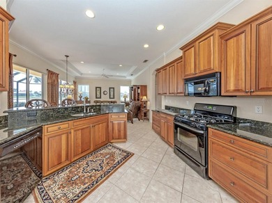 Welcome home to easy Florida living with peaceful lake views on Venetian Golf and River Club in Florida - for sale on GolfHomes.com, golf home, golf lot