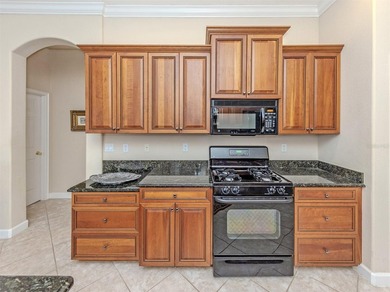 Welcome home to easy Florida living with peaceful lake views on Venetian Golf and River Club in Florida - for sale on GolfHomes.com, golf home, golf lot