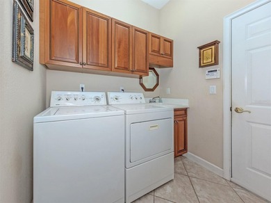 Welcome home to easy Florida living with peaceful lake views on Venetian Golf and River Club in Florida - for sale on GolfHomes.com, golf home, golf lot