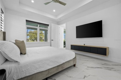 MODERN living in this brand-new Rotonda West residence is proof on Rotonda Golf and Country Club The Palms Course in Florida - for sale on GolfHomes.com, golf home, golf lot