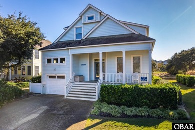 This 4-bedroom, 3-bathroom vacation home in The Currituck Club's on The Currituck Golf Club in North Carolina - for sale on GolfHomes.com, golf home, golf lot