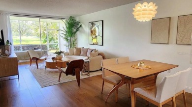 Experience the relaxation of maintenance free living in Palm on Palm Aire Country Club of Sarasota in Florida - for sale on GolfHomes.com, golf home, golf lot