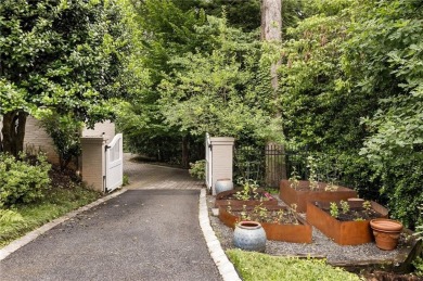 Tucked in the heart of Haynes Manor, this timeless traditional on Bobby Jones Golf Club in Georgia - for sale on GolfHomes.com, golf home, golf lot