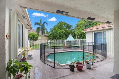 Spacious 3 bed, 3 bath home with private pool located in the on Woodmont Country Club in Florida - for sale on GolfHomes.com, golf home, golf lot