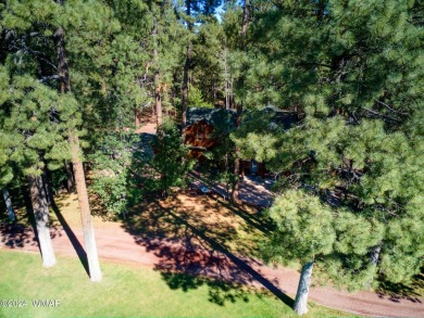 Located on the 11th fairway of Pinetop Lakes Golf and Country on Pinetop Lakes Golf and Country Club in Arizona - for sale on GolfHomes.com, golf home, golf lot