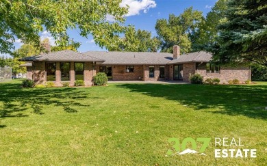 Set on .55 acres along the 16th hole of Olive Glenn Golf Course on Olive Glenn Golf and Country Club in Wyoming - for sale on GolfHomes.com, golf home, golf lot