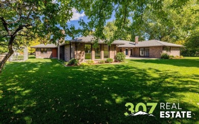 Set on .55 acres along the 16th hole of Olive Glenn Golf Course on Olive Glenn Golf and Country Club in Wyoming - for sale on GolfHomes.com, golf home, golf lot