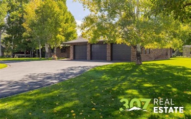Set on .55 acres along the 16th hole of Olive Glenn Golf Course on Olive Glenn Golf and Country Club in Wyoming - for sale on GolfHomes.com, golf home, golf lot
