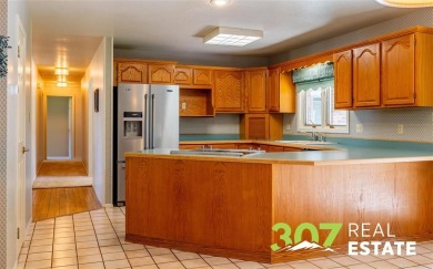 Set on .55 acres along the 16th hole of Olive Glenn Golf Course on Olive Glenn Golf and Country Club in Wyoming - for sale on GolfHomes.com, golf home, golf lot
