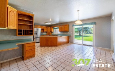 Set on .55 acres along the 16th hole of Olive Glenn Golf Course on Olive Glenn Golf and Country Club in Wyoming - for sale on GolfHomes.com, golf home, golf lot