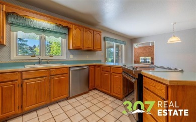 Set on .55 acres along the 16th hole of Olive Glenn Golf Course on Olive Glenn Golf and Country Club in Wyoming - for sale on GolfHomes.com, golf home, golf lot