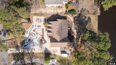 Don't miss out on this incredible canal-front home situated on on Duck Woods Country Club in North Carolina - for sale on GolfHomes.com, golf home, golf lot