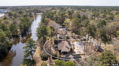 Don't miss out on this incredible canal-front home situated on on Duck Woods Country Club in North Carolina - for sale on GolfHomes.com, golf home, golf lot
