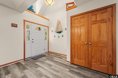 Don't miss out on this incredible canal-front home situated on on Duck Woods Country Club in North Carolina - for sale on GolfHomes.com, golf home, golf lot