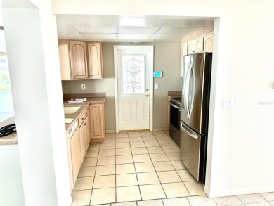 Wow!! Amazing home which has been remodeled beautifully in the on Mainlands Golf Club in Florida - for sale on GolfHomes.com, golf home, golf lot