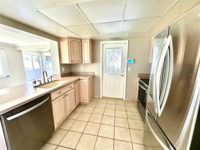 Wow!! Amazing home which has been remodeled beautifully in the on Mainlands Golf Club in Florida - for sale on GolfHomes.com, golf home, golf lot