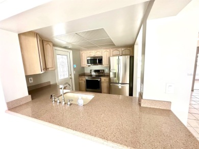 Wow!! Amazing home which has been remodeled beautifully in the on Mainlands Golf Club in Florida - for sale on GolfHomes.com, golf home, golf lot