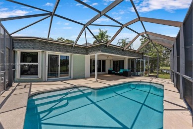 Welcome to your private canalfront escape in the sought-after on Woodlands Country Club in Florida - for sale on GolfHomes.com, golf home, golf lot
