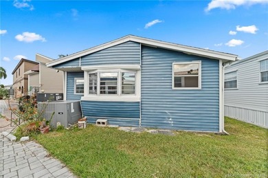 Charming and renovated is this 2 bedroom 1 bathroom getaway in on Island Dunes Country Club in Florida - for sale on GolfHomes.com, golf home, golf lot