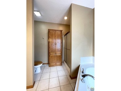 Lake living usually encourages boat, jet ski, golf cart, SXS on Lake Perry Country Club in Kansas - for sale on GolfHomes.com, golf home, golf lot