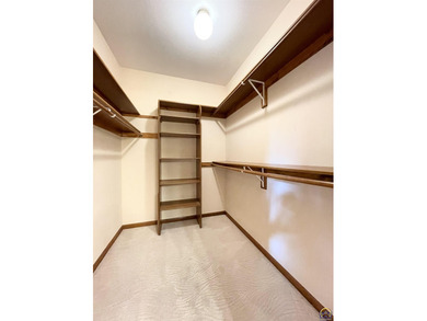 Lake living usually encourages boat, jet ski, golf cart, SXS on Lake Perry Country Club in Kansas - for sale on GolfHomes.com, golf home, golf lot