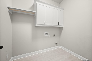 Classic architectural charm meets refined comfort in this on Carter Plantation Golf Course in Louisiana - for sale on GolfHomes.com, golf home, golf lot