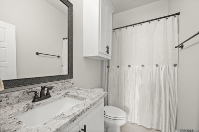 Classic architectural charm meets refined comfort in this on Carter Plantation Golf Course in Louisiana - for sale on GolfHomes.com, golf home, golf lot