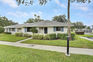 Located in the highly desirable Club Cottages within PGA on PGA National Golf Club in Florida - for sale on GolfHomes.com, golf home, golf lot