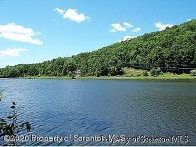 Saddle Lake . Water front building lot on the channel  with on Stone Hedge Golf Course in Pennsylvania - for sale on GolfHomes.com, golf home, golf lot
