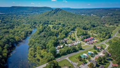 Brand New Exterior Paint completed April 2025! Adorable River on Riverland Country Club in Arkansas - for sale on GolfHomes.com, golf home, golf lot