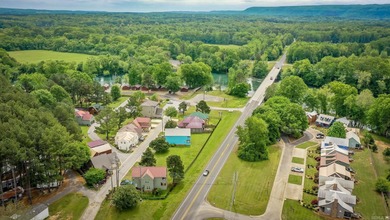 Brand New Exterior Paint completed April 2025! Adorable River on Riverland Country Club in Arkansas - for sale on GolfHomes.com, golf home, golf lot