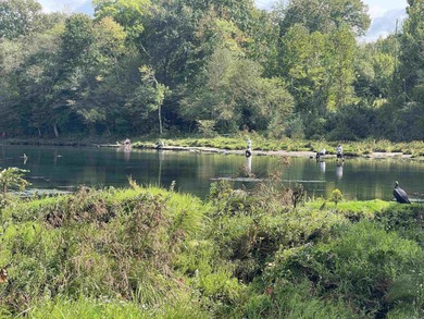 Brand New Exterior Paint completed April 2025! Adorable River on Riverland Country Club in Arkansas - for sale on GolfHomes.com, golf home, golf lot