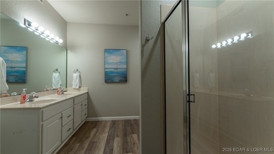 Enjoy incredible lake views from this spacious 4-bedroom, 3-bath on Tan-Tar-A Golf Club in Missouri - for sale on GolfHomes.com, golf home, golf lot