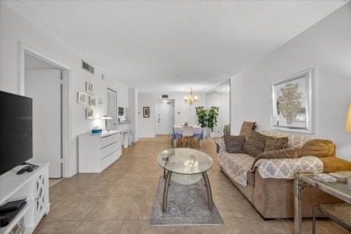 Live the Florida dream in this beautiful waterfront condo on on Isla Del Sol Yacht and Country Club in Florida - for sale on GolfHomes.com, golf home, golf lot