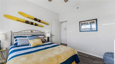 Enjoy incredible lake views from this spacious 4-bedroom, 3-bath on Tan-Tar-A Golf Club in Missouri - for sale on GolfHomes.com, golf home, golf lot