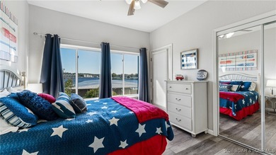 Enjoy incredible lake views from this spacious 4-bedroom, 3-bath on Tan-Tar-A Golf Club in Missouri - for sale on GolfHomes.com, golf home, golf lot