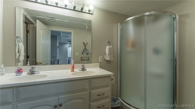 Enjoy incredible lake views from this spacious 4-bedroom, 3-bath on Tan-Tar-A Golf Club in Missouri - for sale on GolfHomes.com, golf home, golf lot