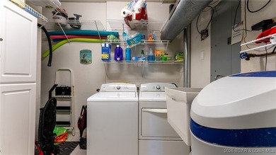 Enjoy incredible lake views from this spacious 4-bedroom, 3-bath on Tan-Tar-A Golf Club in Missouri - for sale on GolfHomes.com, golf home, golf lot