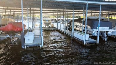 Enjoy incredible lake views from this spacious 4-bedroom, 3-bath on Tan-Tar-A Golf Club in Missouri - for sale on GolfHomes.com, golf home, golf lot