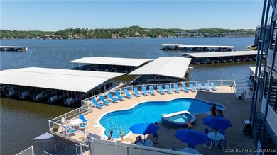 Enjoy incredible lake views from this spacious 4-bedroom, 3-bath on Tan-Tar-A Golf Club in Missouri - for sale on GolfHomes.com, golf home, golf lot