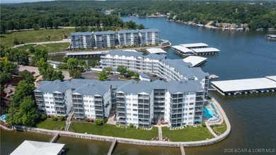 Enjoy incredible lake views from this spacious 4-bedroom, 3-bath on Tan-Tar-A Golf Club in Missouri - for sale on GolfHomes.com, golf home, golf lot