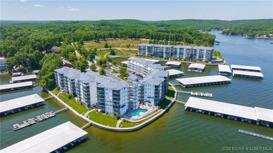 Enjoy incredible lake views from this spacious 4-bedroom, 3-bath on Tan-Tar-A Golf Club in Missouri - for sale on GolfHomes.com, golf home, golf lot