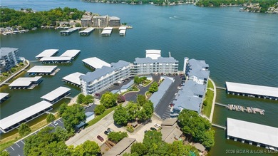 Enjoy incredible lake views from this spacious 4-bedroom, 3-bath on Tan-Tar-A Golf Club in Missouri - for sale on GolfHomes.com, golf home, golf lot