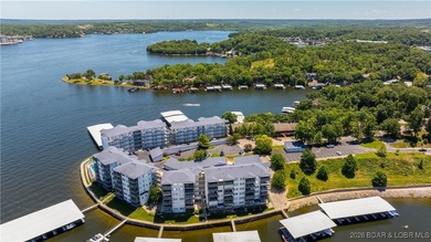 Enjoy incredible lake views from this spacious 4-bedroom, 3-bath on Tan-Tar-A Golf Club in Missouri - for sale on GolfHomes.com, golf home, golf lot