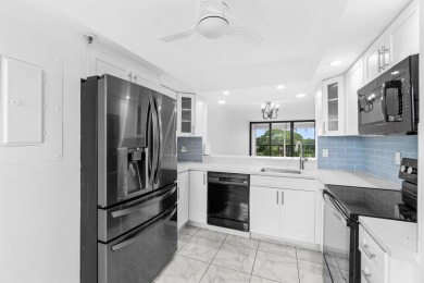Beautifully renovated home with an amazing lake and golf view in on  in Florida - for sale on GolfHomes.com, golf home, golf lot