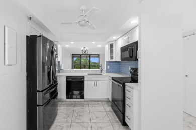 Beautifully renovated home with an amazing lake and golf view in on  in Florida - for sale on GolfHomes.com, golf home, golf lot