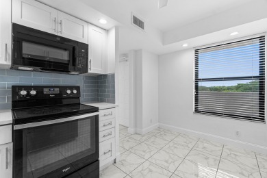 Beautifully renovated home with an amazing lake and golf view in on  in Florida - for sale on GolfHomes.com, golf home, golf lot