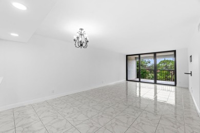 Beautifully renovated home with an amazing lake and golf view in on  in Florida - for sale on GolfHomes.com, golf home, golf lot
